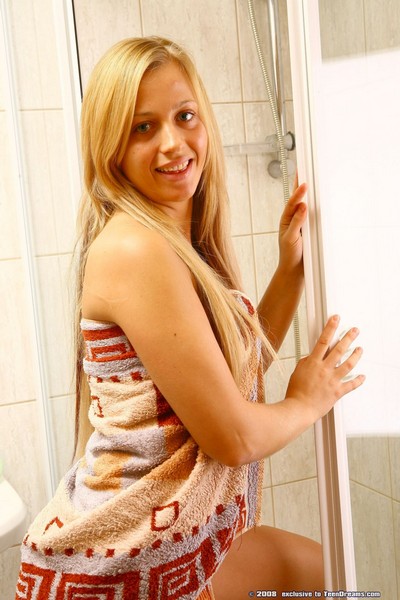 Sexy young blonde flashing dripping pussy in shower